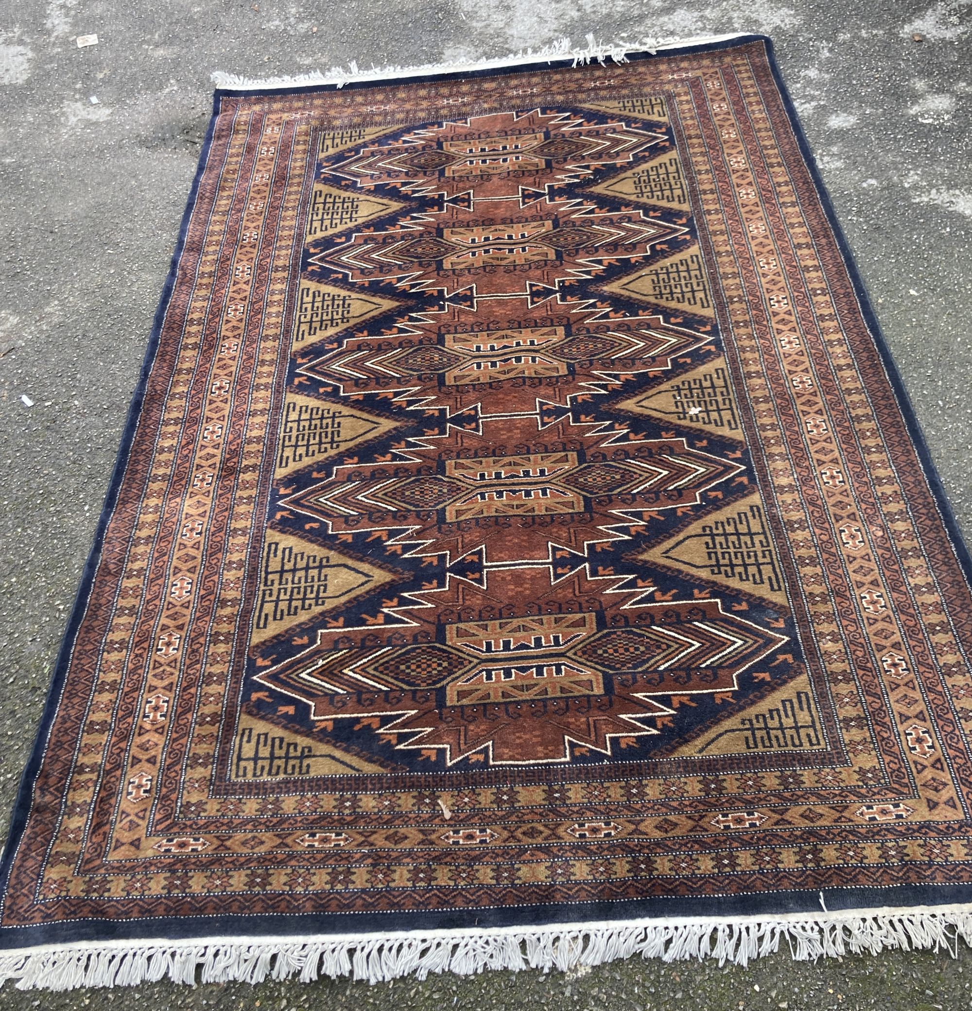 A Caucasian brown ground carpet, 280 x 190cm